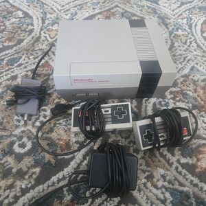 Nintendo Entertainment System with Gray and Black Controllers